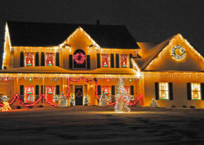 2 story house with christmas lights